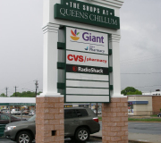 Ad sign of The Shops at Queens Chillum